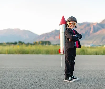 young boy businessman ready to fly